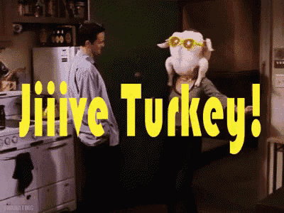 a man standing next to a woman with a turkey on her head and the words jiive turkey
