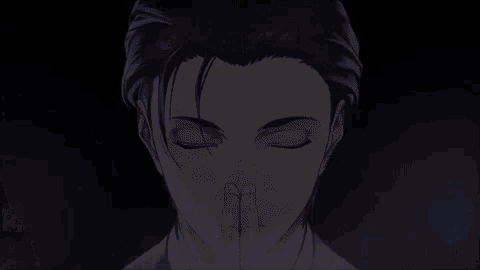 a close up of a man with his eyes closed and his hands together .