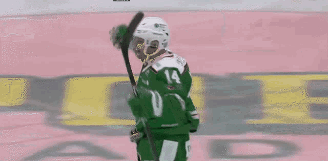 a hockey player with the number 14 on his shirt
