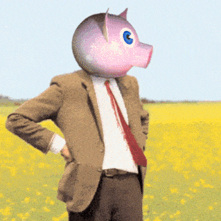 a man in a suit and tie has a pink pig head on his head