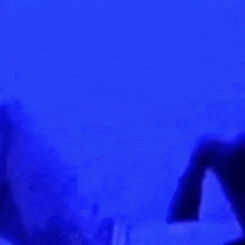 a person in a blue shirt is looking down