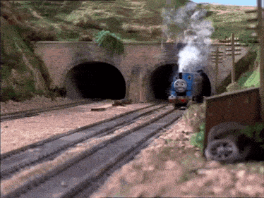 thomas the train is going through a tunnel and smoke is coming out of it