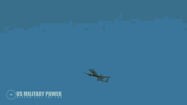 a us military power logo is displayed on a desert scene