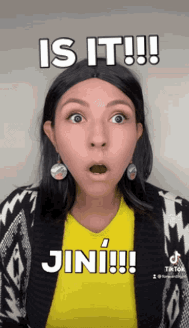 a woman with a surprised look on her face and the words is it jini !!!