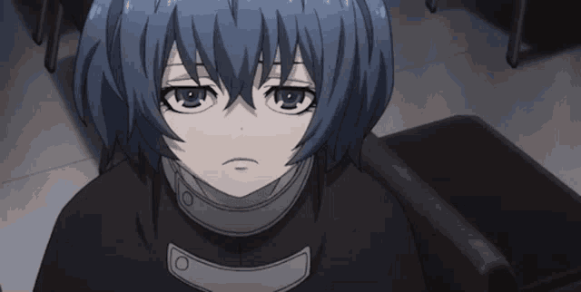 a close up of a person 's face with blue hair