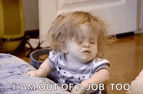 a little girl is sitting on a couch with her eyes closed and making a face .