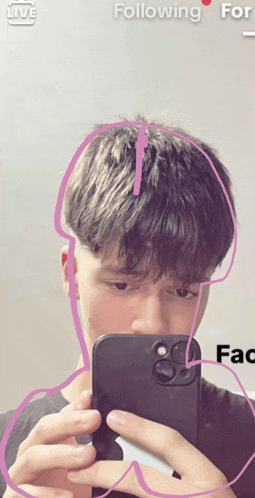 a man is taking a picture of himself with a drawing of a penis in his hair