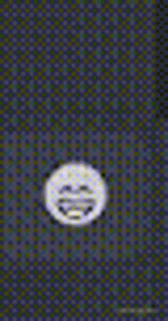 a yellow smiley face is sitting on top of a purple and blue checkered background .