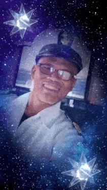 a man with glasses and a hat smiles in front of a starry sky