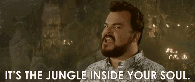 a man with a beard is saying " it 's the jungle inside your soul "