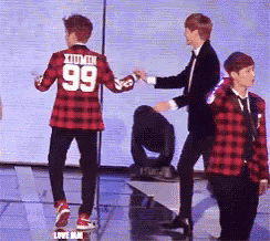 a man in a plaid shirt with the number 99 on the back