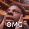 a close up of a man 's face with the words omg written on it .