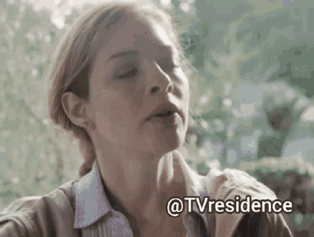 a close up of a woman 's face with the words " @tvresidence " below her