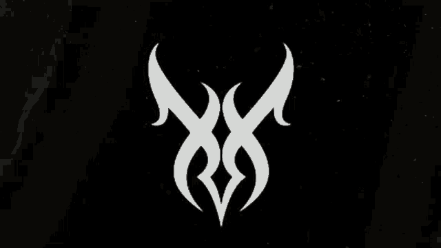 a white symbol on a black background that looks like a tribal design