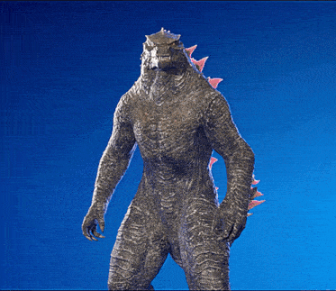 a statue of a monster with spikes on its arms and legs