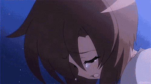 a girl with brown hair is crying with her eyes closed and a blue background .
