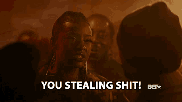 a woman says you stealing shit in a crowd of people