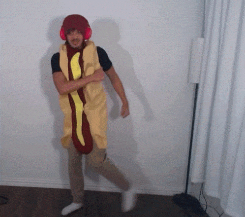 a man wearing a hot dog costume and headphones
