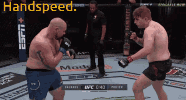 two men are fighting in a boxing ring with the words handspeed on the top