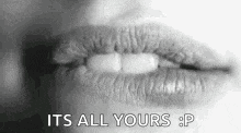 a close up of a woman 's lips with the words `` it 's all yours : p '' written on it .