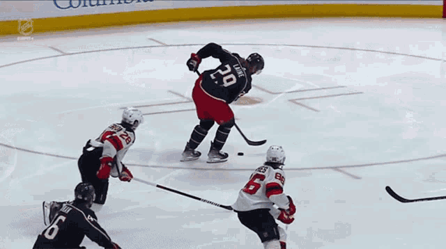 a hockey game is being played with a pepsi ad in the background