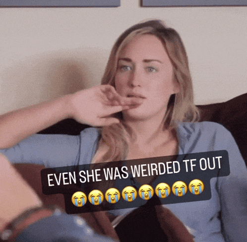 a woman is sitting on a couch with a caption that says even she was weirded tf out