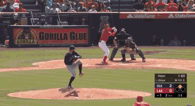 a baseball game is underway with a gorilla glue ad in the outfield