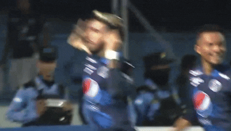 two soccer players wearing blue pepsi jerseys celebrate a goal