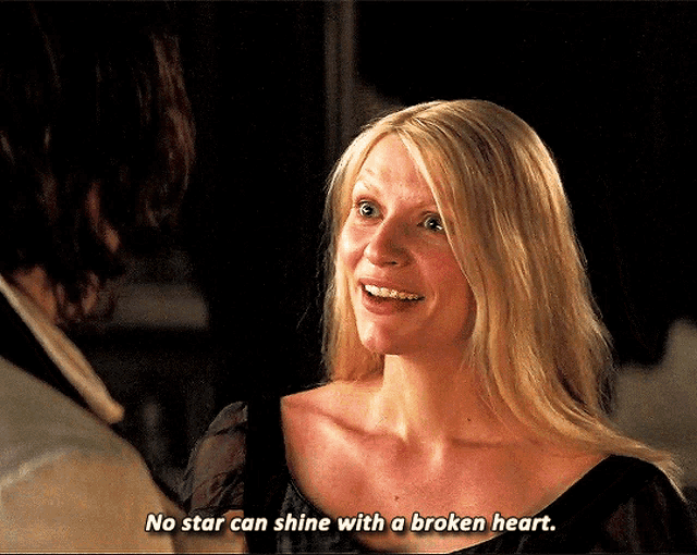 a woman says " no star can shine with a broken heart " while smiling