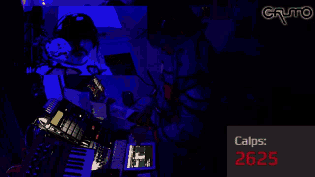 a picture of a man playing a keyboard with the words calps 2626 in red