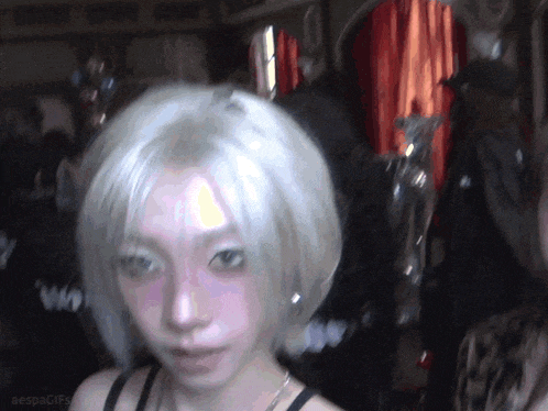 a gif of a woman 's face with the words aespagifs on the bottom right