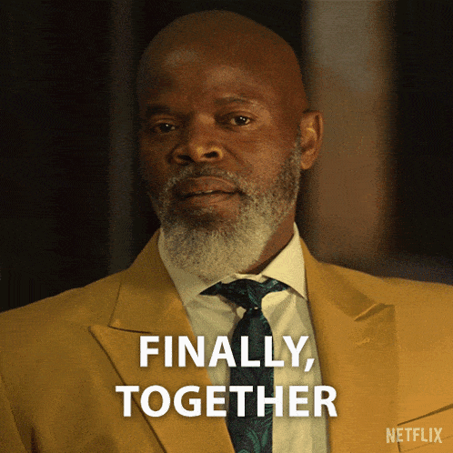 a man in a suit and tie says " finally together "