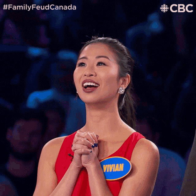 a woman in a red tank top has a name tag that says vivian