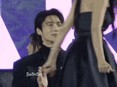 a man in a black shirt with barbae ben on it