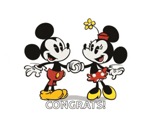 mickey mouse and minnie mouse are shaking hands and kissing each other .