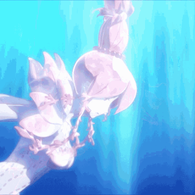 a cartoon character is swimming in the ocean and has a pink flower on her head