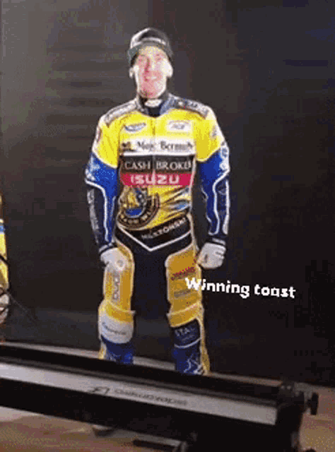 a man in a yellow and blue racing suit is standing on a treadmill with the words winning toast written below him