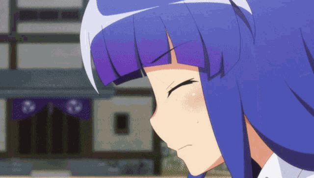 a close up of a girl with blue hair