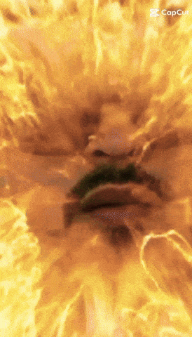 a close up of a person 's face surrounded by fire with the caption capcut