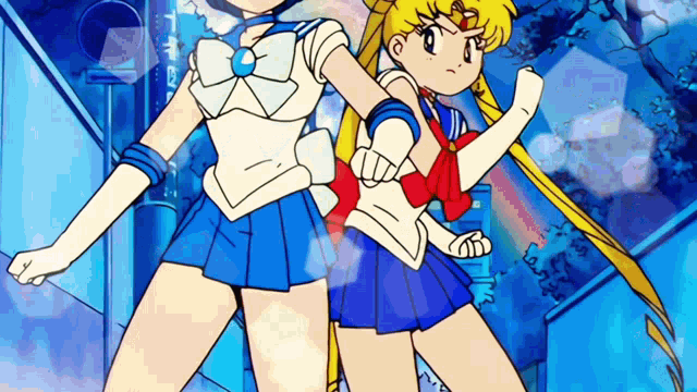 sailor moon and mercury are standing next to each other in a cartoon