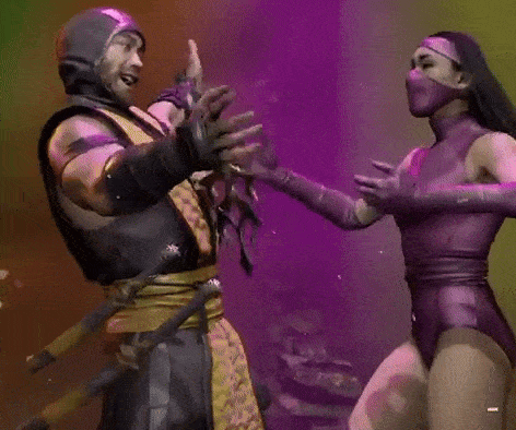 a man and a woman in purple costumes are dancing together .