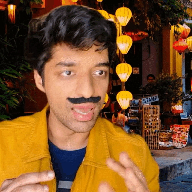 a man with a fake mustache is standing in front of a stamp store