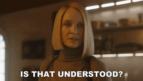 a woman in a turtleneck sweater is asking is that understood