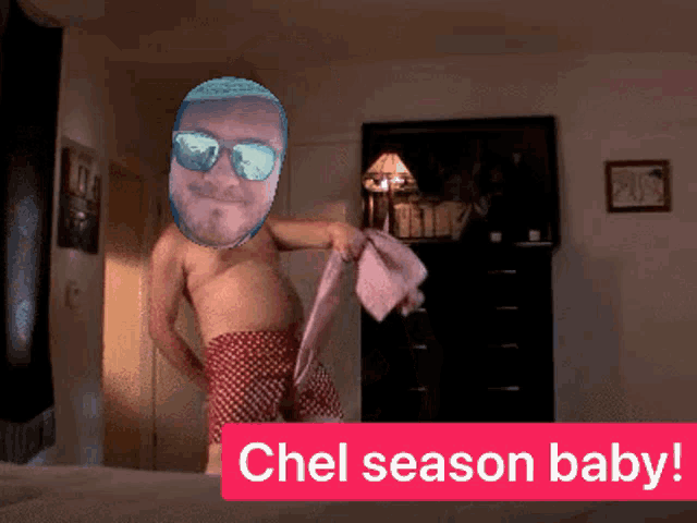 a man without a shirt is holding a pink towel with the words chel season baby written below him