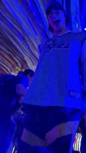 a person wearing a blue jersey that says la on it