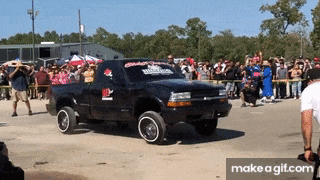 a black truck with a sticker on the windshield that says ' texas ' on it