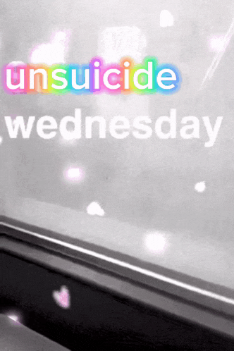 a sign that says ' unsuicide wednesday ' on a window