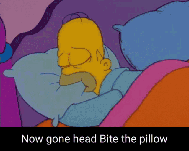 a cartoon of homer simpson laying on a bed with the words now gone head bite the pillow below him