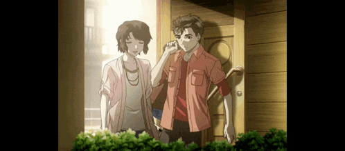 a man and a woman standing in front of a door
