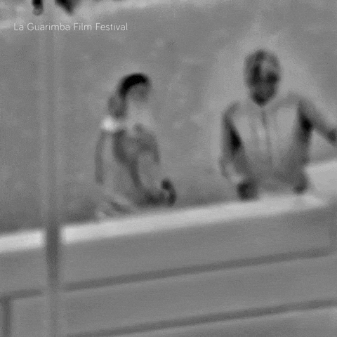 a black and white photo of two people with la guarimba film festival written on the bottom